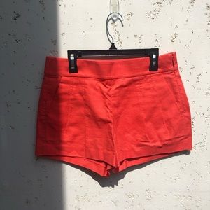 Coral pleated shorts